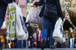 People carry bags outside department store on last day of Christmas shopping in Berlin
