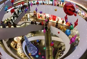 Shoppers walk under Christmas decorations at the Sihlcity shopping mall during a special Sunday sale in Zurich